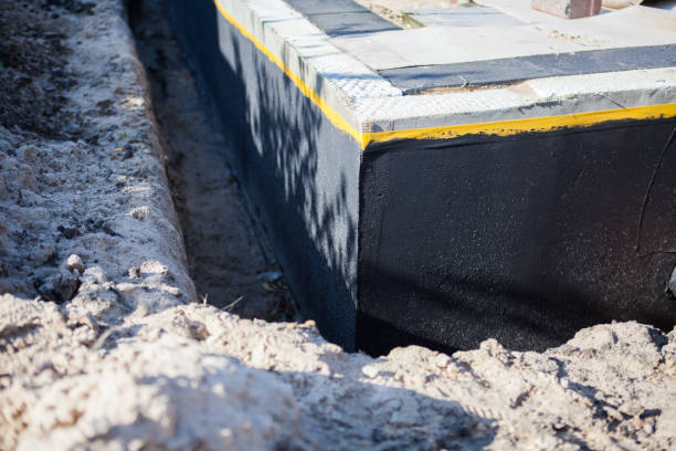 Professional Waterproofing technician working in Muskego, WI
